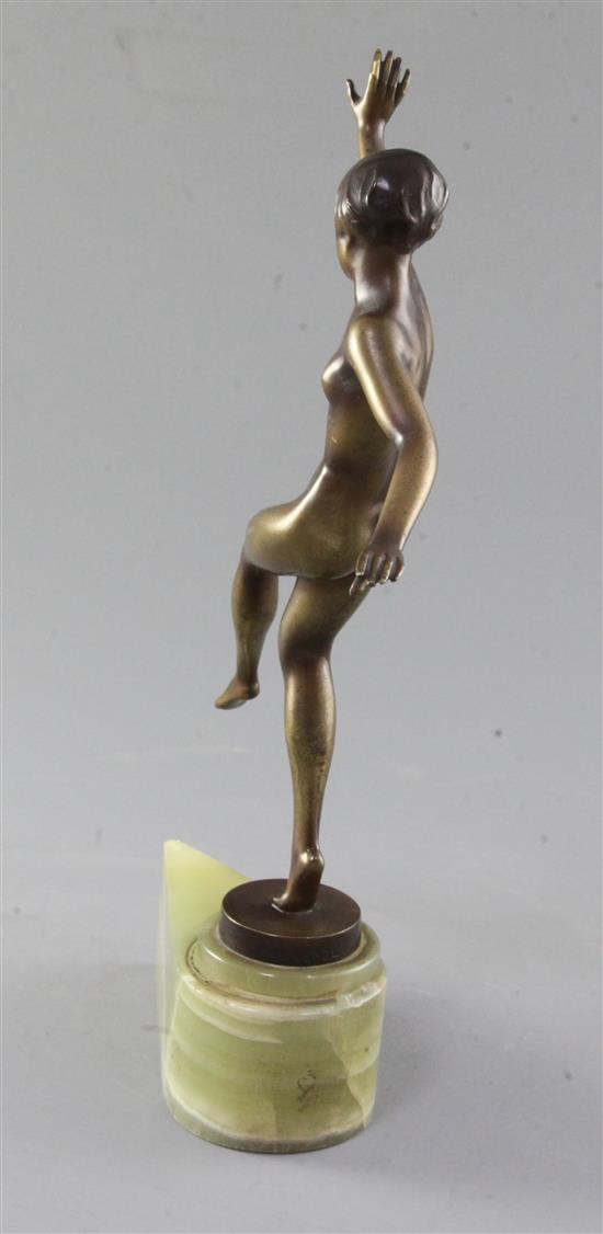 A Lorenzl Art Deco bronzed figure of a nude dancing girl, height 11in.